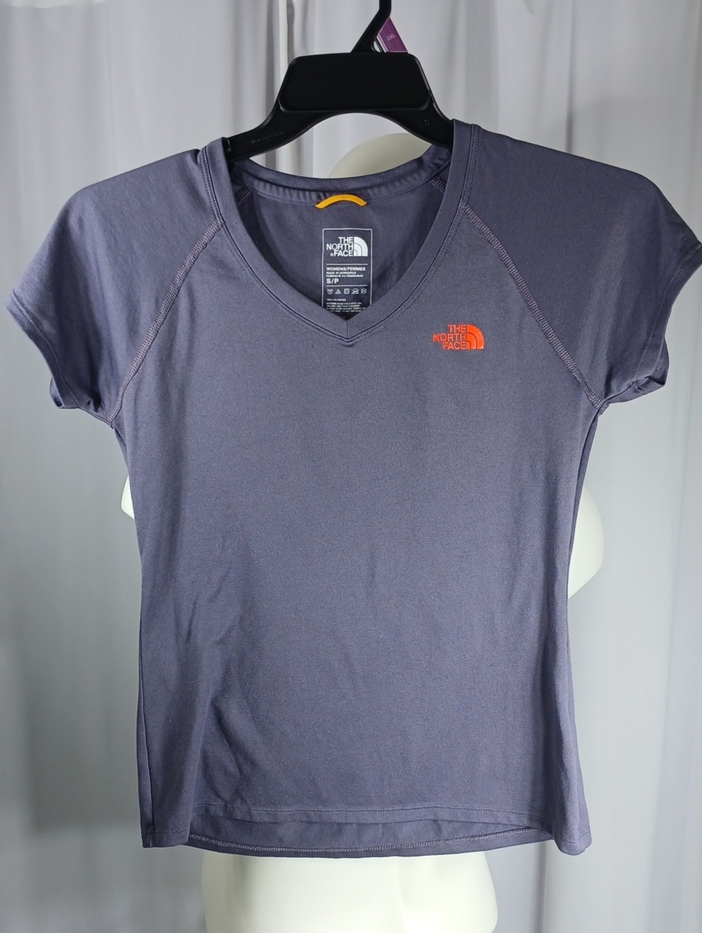 The North Face Women’s Heather Purple V‑Neck Short Sleeve Tee with Orange Logo